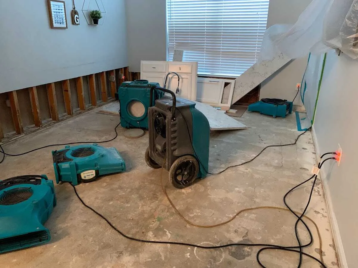 Dehumidifier in flood-cut room for Water Damage Restoration in Eden